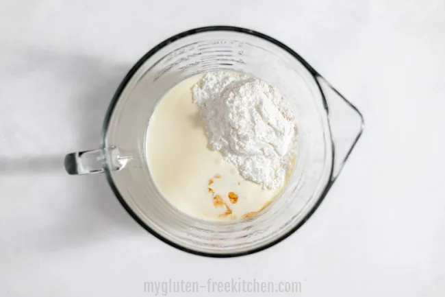 bowl with cream powdered sugar and vanilla