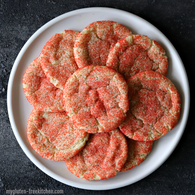 Stack of red gluten-free sugar cookies 