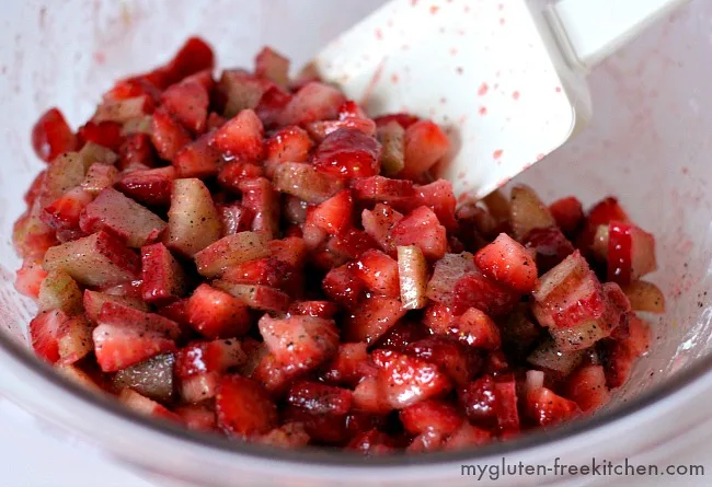 Bowl with strawberry rhubarb mixture for gluten-free hand pies