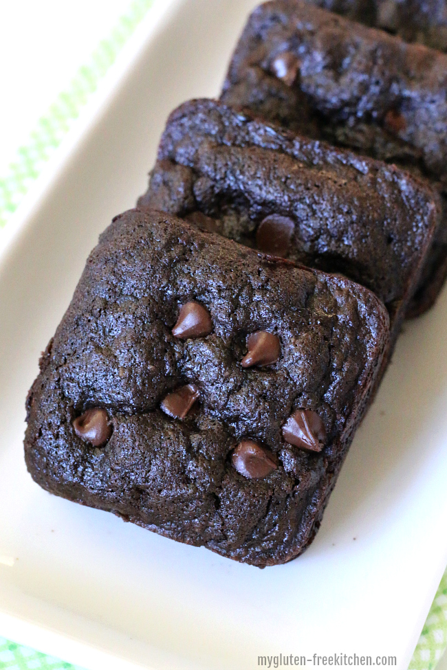 white plate with three Gluten-free Zucchini Cake Brownie Squares