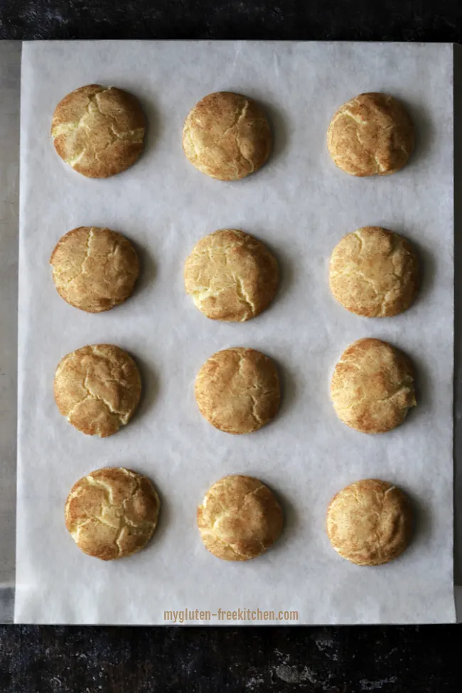 Baked gluten-free snickerdoodles on cookie sheet