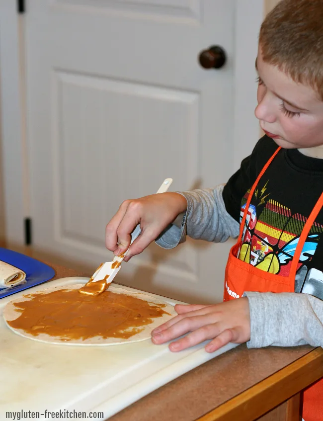 Making peanut butter tortilla roll ups