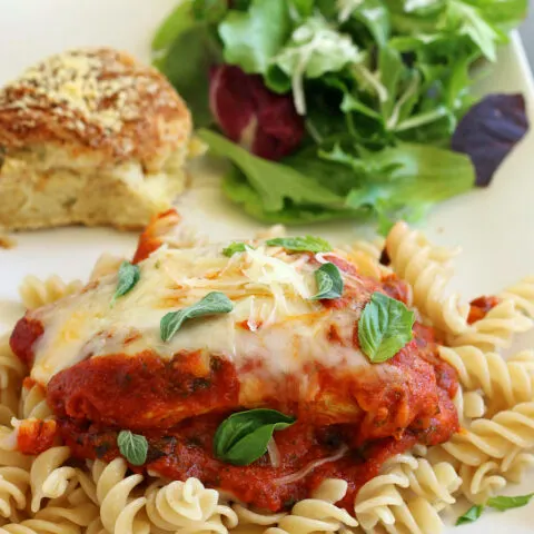 Gluten-free Skillet Chicken Parmesan with salad and gluten-free roll