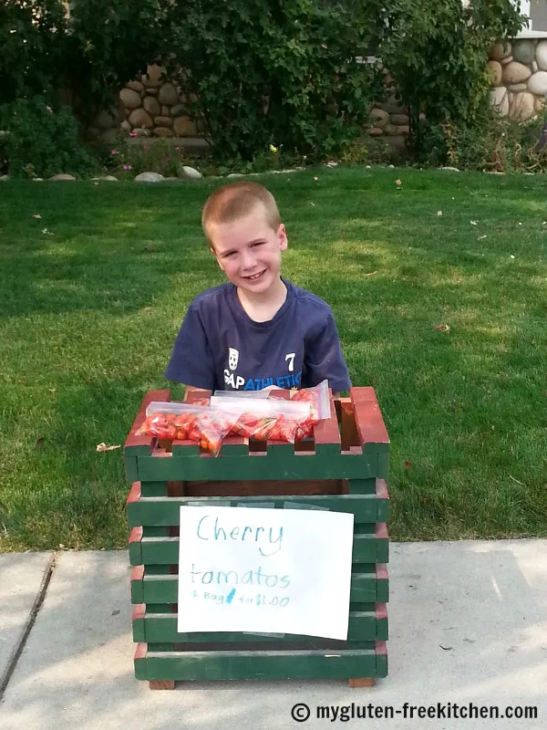Gardenign with kids: My son selling cherry tomatoes that he grew and harvested!