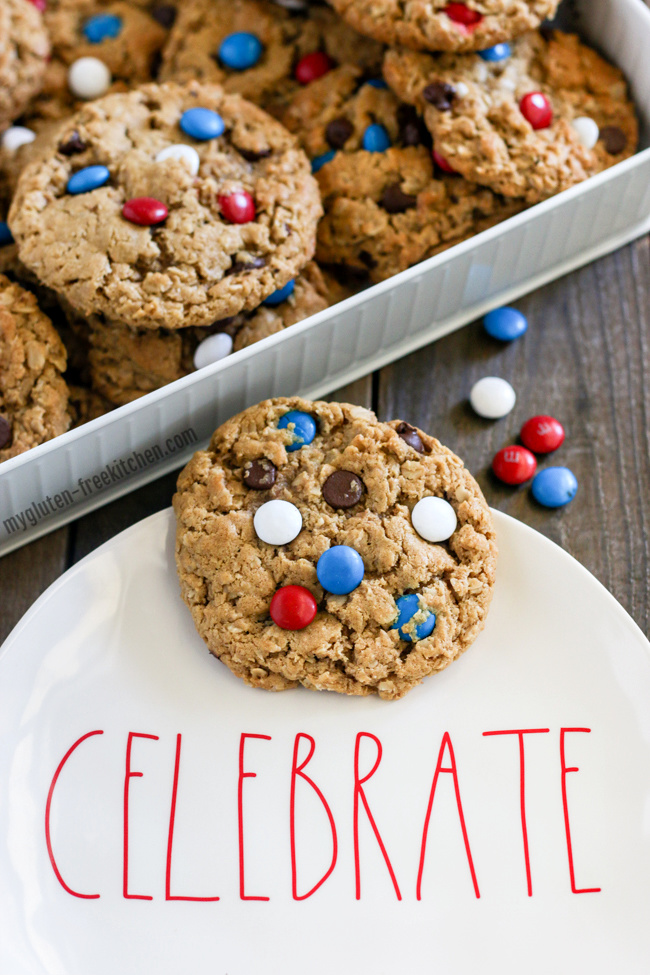 Patriotic Gluten-free Monster Cookies - cookies with red, white, and blue M&Ms with plate that says celebrate