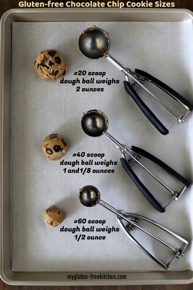 Cookie sheet with three sizes of cookie dough balls and scoops