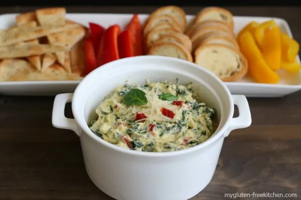 Artichoke Spinach Dip with gluten-free baguette slices and pizza wedges