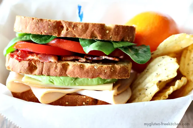 Gluten-free California Club Sandwich. Served with chips and fruit and the whole family loved it!