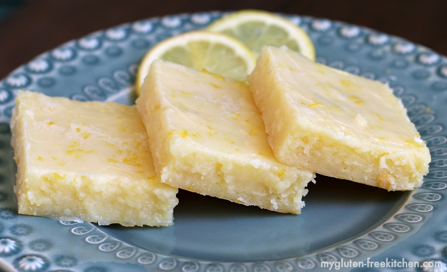 Delicious brownies but in lemon form! Rich, gluten-free dessert bars that are perfect for spring and summer potlucks!