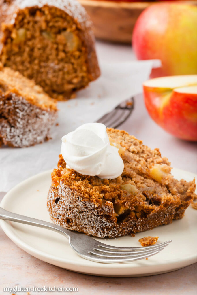 Gluten-free Apple Cake with whipped cream on plate