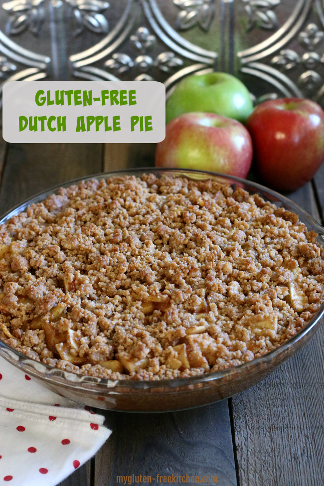 Gluten-free Dutch Apple Pie in pan with apples beside it