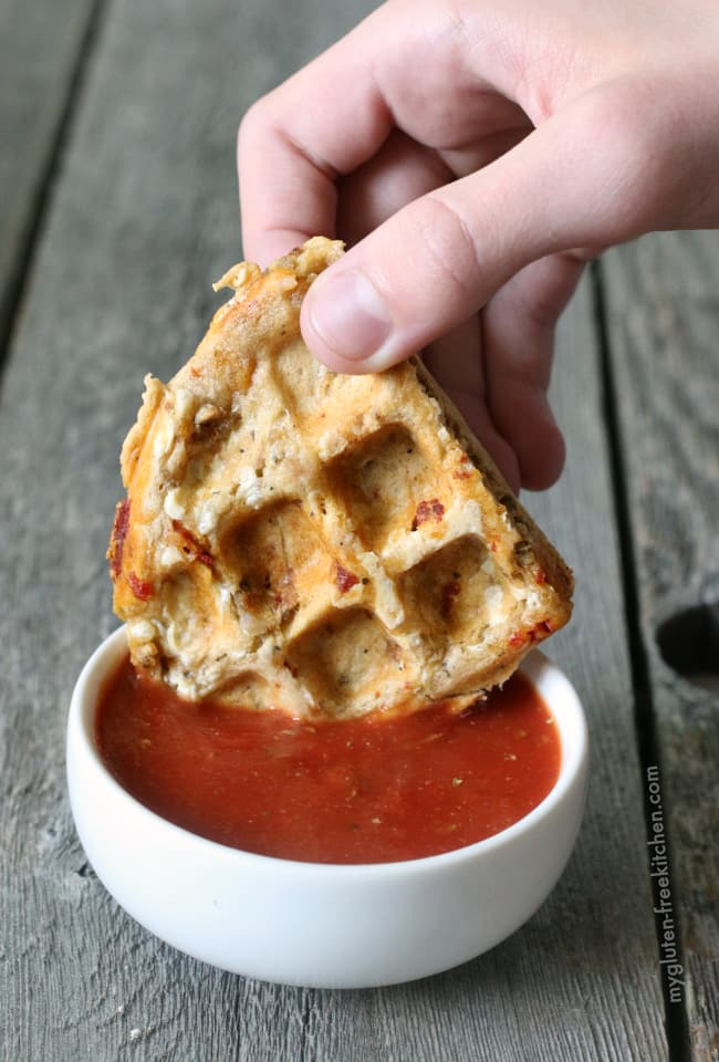 Gluten-free Pizza Waffles dipped in pizza sauce