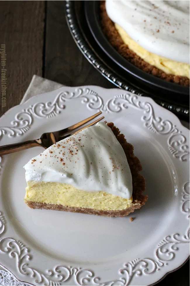 Slice of Gluten-free Eggnog Pie on plate with pie in background