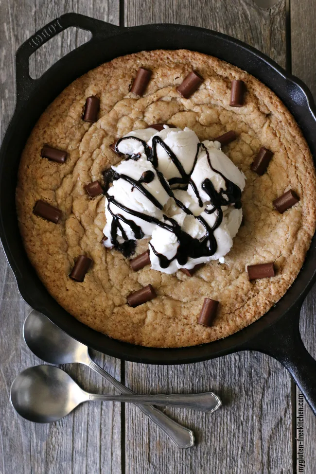Gluten-free Chocolate Chunk Skillet Cookie. This gluten-free skillet cookie is dairy-free too! Served hot out of the cast iron pan and so yummy!