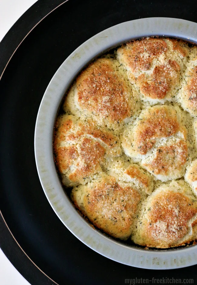 Gluten-free Dinner rolls coated with yummy Garlic Parmesan Butter mixture! We love these with pasta dinner!