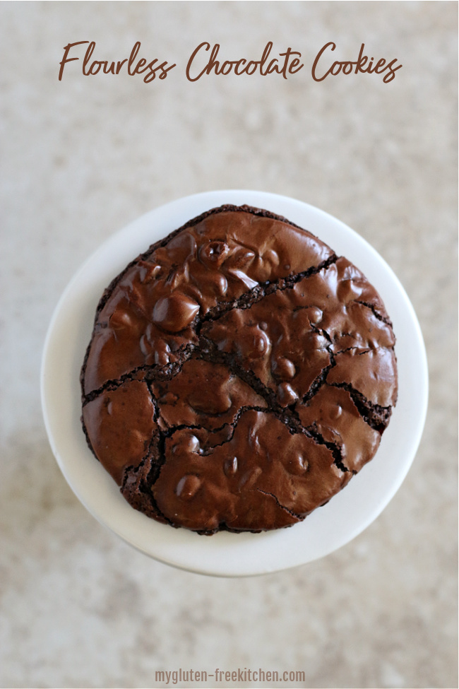 single flourless chocolate cookie on a white plate