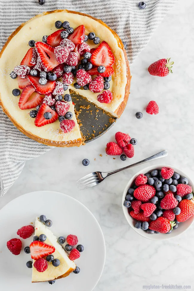 Gluten-free Cheesecake with graham cracker crust and berries on top