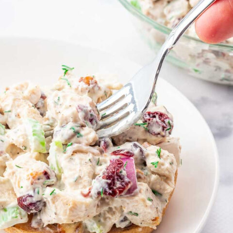 Gluten Free Chicken Salad on a bun with a fork