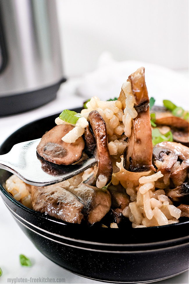 Instant Pot in background with Mushroom Risotto in bowl